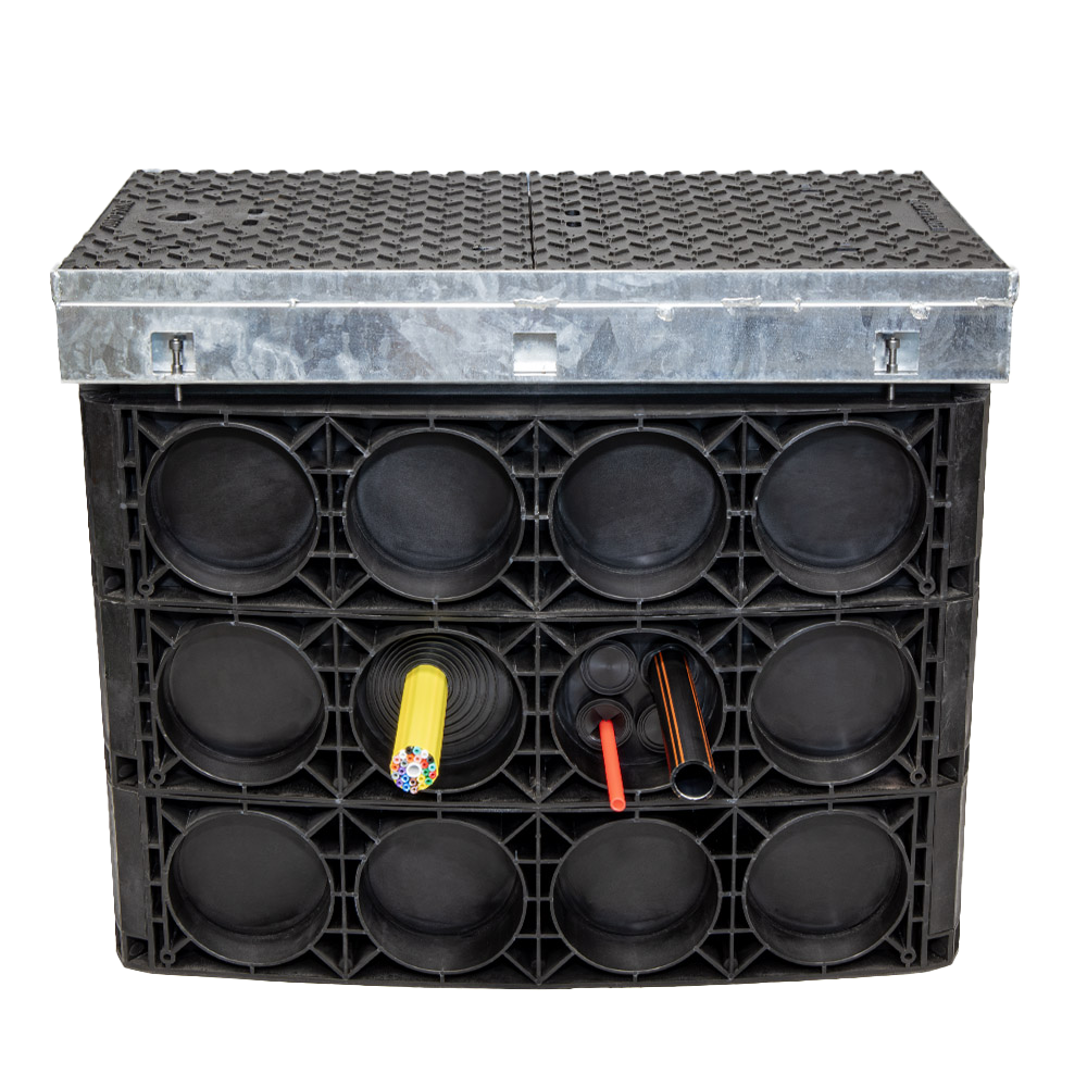 Chamber HQS provides an easier, more flexible, and more sustainable alternative to concrete and brick-built chambers with benefits to network owners and constructors alike. 
Chambers are supplied in flat pieces or rings for efficient transportation and storage and easy on-site configuration in as little as 20 minutes. Prefabricated entry points can be removed quickly with a hammer (and without a drill) before a rubber seal is installed around the conduits, MicroDucts, or MicroDuct bundles entering the duct to prevent the ingress of soil or other debris. Finally, the metal frame for the Chamber HQS’ cover is adjustable to ensure the cover is installed at the correct height and angle.