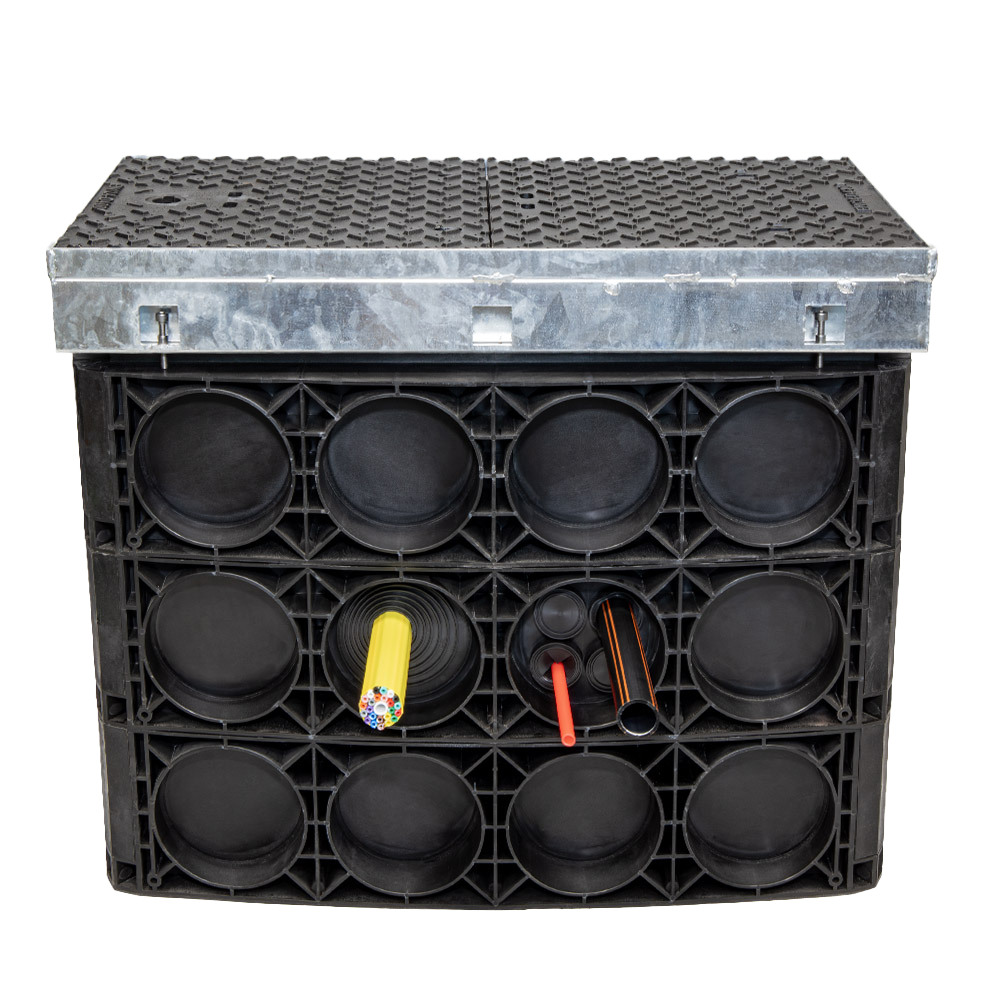 Chamber HQS provides an easier, more flexible, and more sustainable alternative to concrete and brick-built chambers with benefits to network owners and constructors alike. 
Chambers are supplied in flat pieces or rings for efficient transportation and storage and easy on-site configuration in as little as 20 minutes. Prefabricated entry points can be removed quickly with a hammer (and without a drill) before a rubber seal is installed around the conduits, MicroDucts, or MicroDuct bundles entering the duct to prevent the ingress of soil or other debris. Finally, the metal frame for the Chamber HQS’ cover is adjustable to ensure the cover is installed at the correct height and angle.